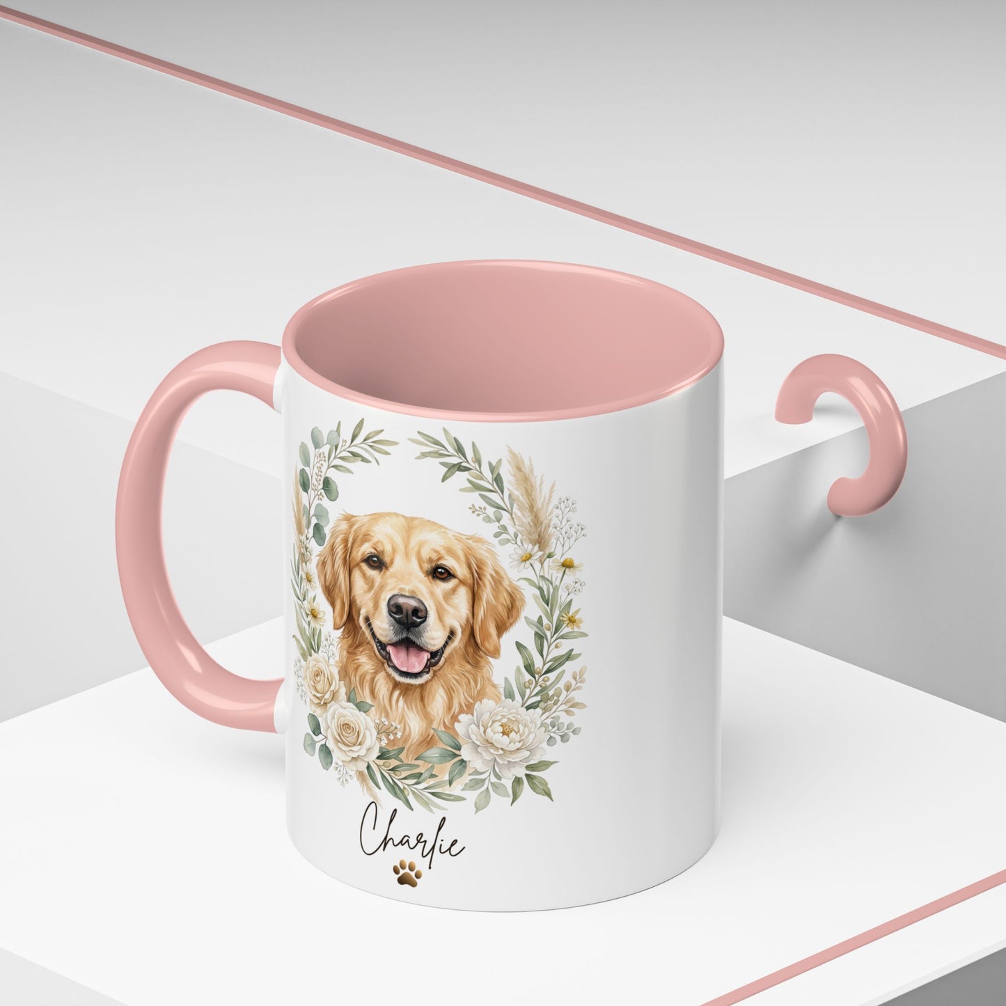 White mug with pink interior and handle, featuring a golden retriever illustration and the name 'Charlie'.